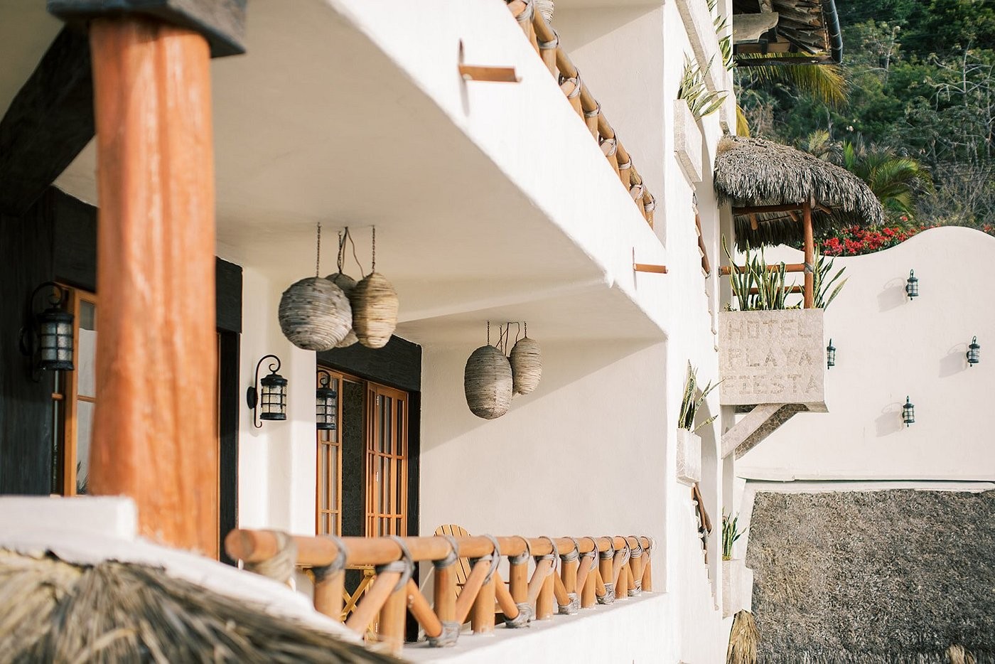 Hotel Playa Fiesta balcony detail with wicker pendant lights