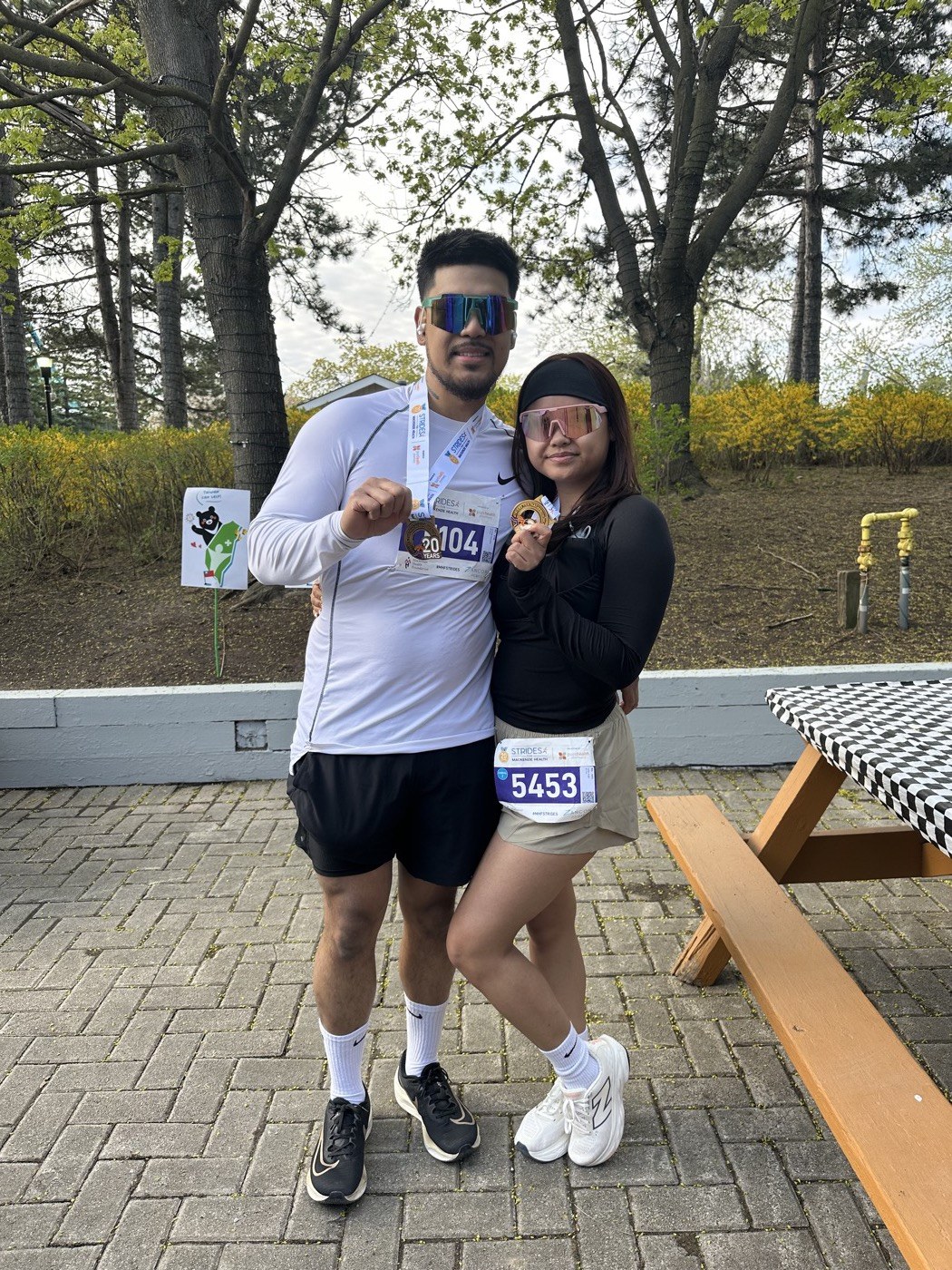 Philip and Kaitlin holding race medals