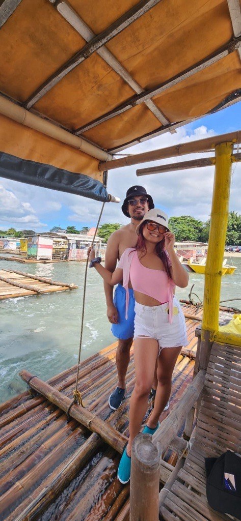 Philip and Kaitlin on a bamboo raft