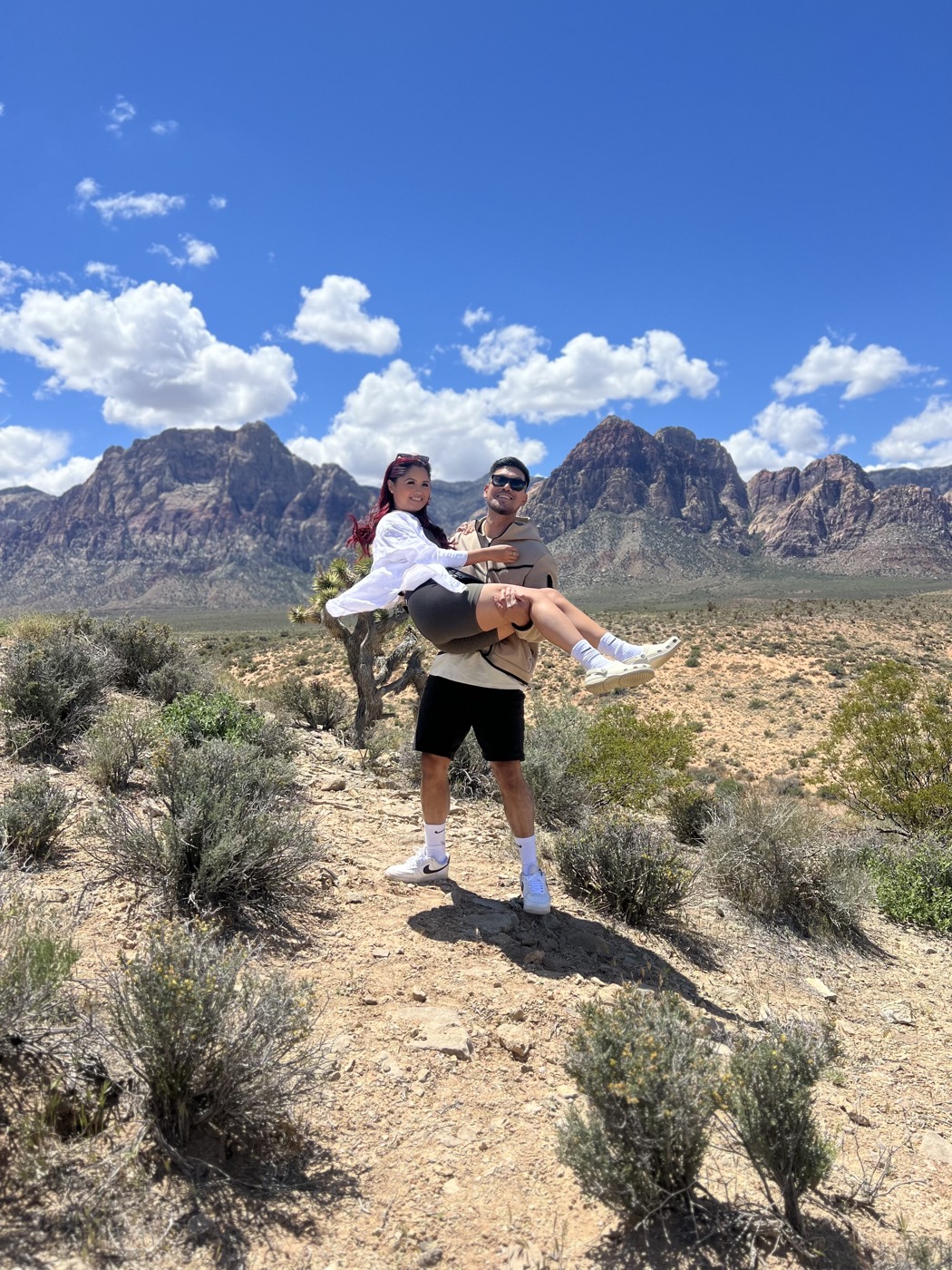 Phil carrying Kaitlin at Red Rock Canyon
